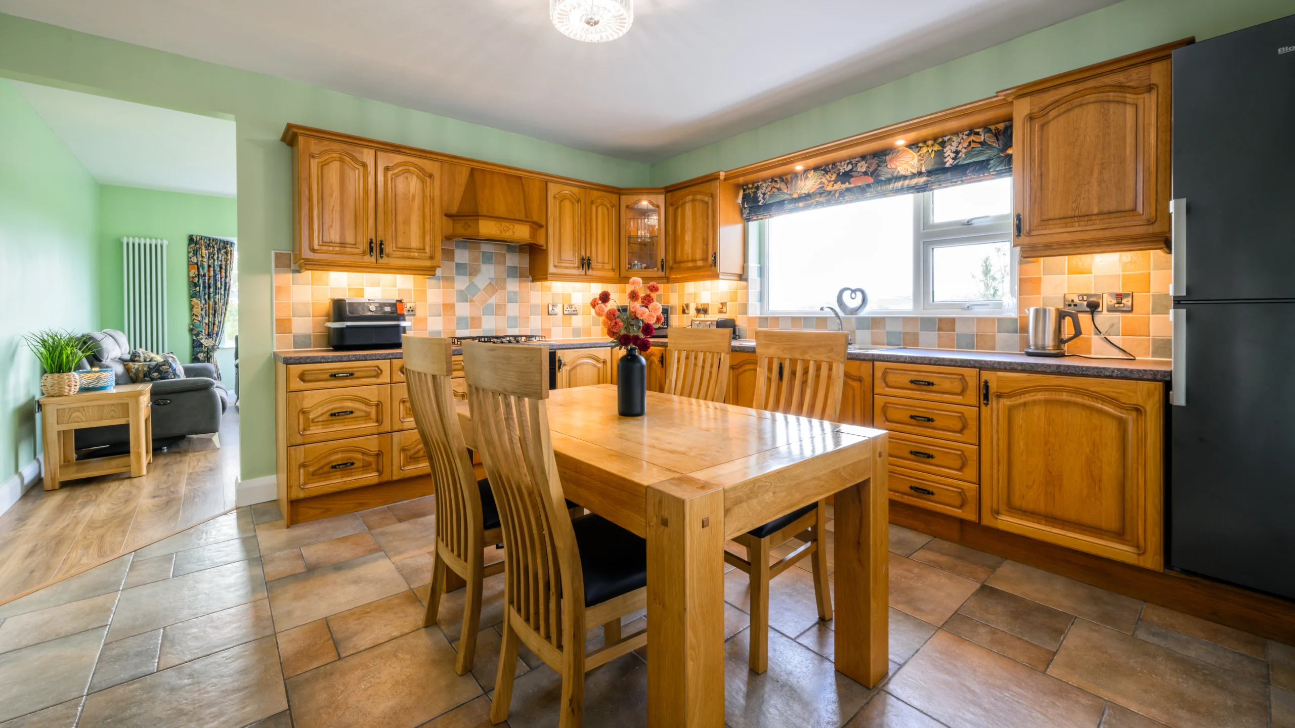 Image of the kitchen connected to the living room at Rosie's Cottage
