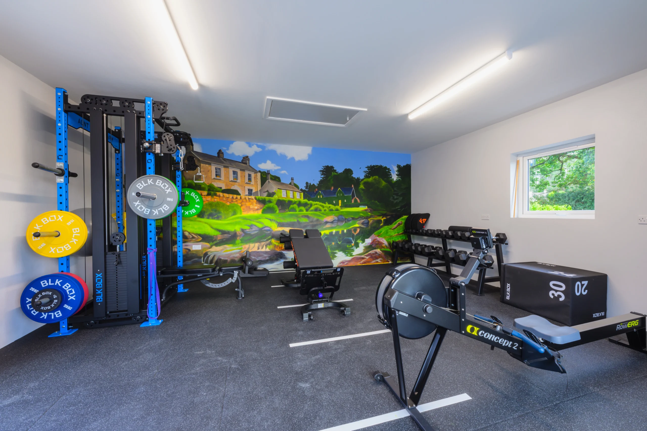 Image of the gym equipment and mural at Rosie's Cottage