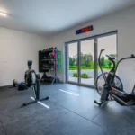 Photo of Rosie's cottage gym photo pointing outside with the glass doors shut