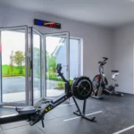 Photo of Rosie's cottage gym photo pointing outside with the glass doors open