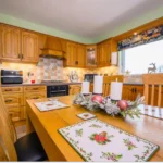 Image of the kitchen in Rosie's Cottage decorated for Christmas