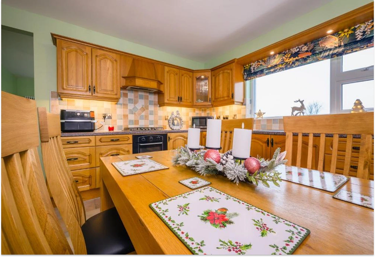 Image of the kitchen in Rosie's Cottage decorated for Christmas