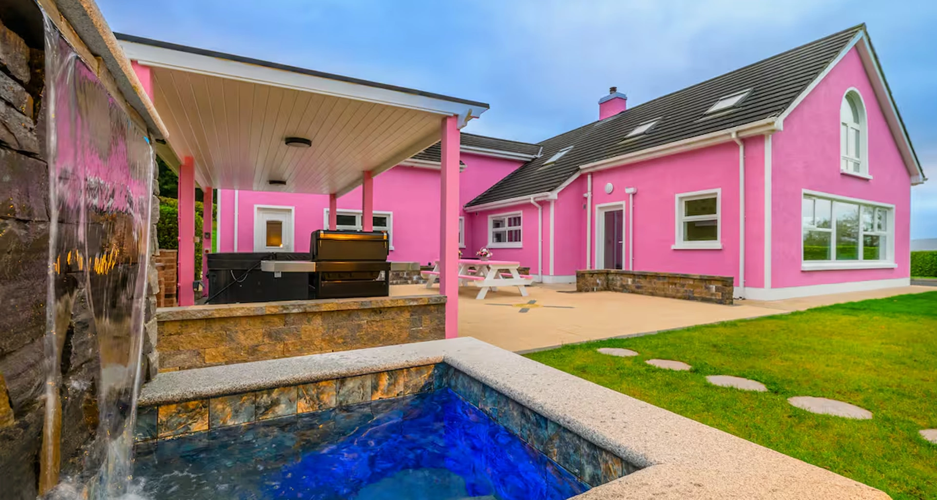 An image of Lily's Pink House taken from near the plunge pool