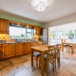 An image showcasing the Dining room and kitchen at Rosie's Cottage